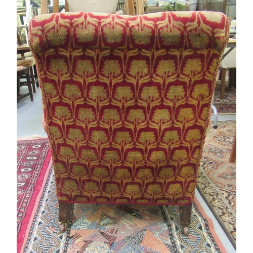 244 - An Edwardian red and gold coloured floral fabric upholstered salon chair, raised on mahogany turned,... 