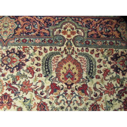 248 - A Persian design rug, decorated with repeating floral motifs, on a beige ground  100