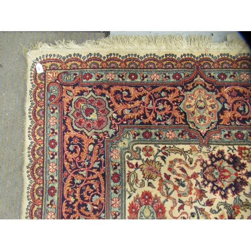 248 - A Persian design rug, decorated with repeating floral motifs, on a beige ground  100