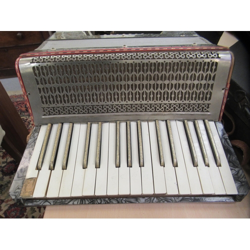 265 - A Tonela twenty-four key grey marble effect cased piano accordion 