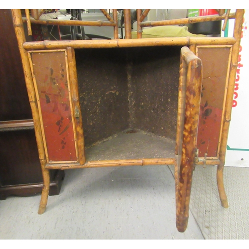 268 - An early/mid 20thC bamboo framed corner unit, having a mirrored upstand, over an open shelf and anot... 