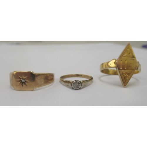 72 - Two 9ct gold rings, one with an engraved tablet; and a yellow, rubover set diamond signet ring 