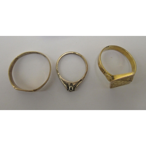 72 - Two 9ct gold rings, one with an engraved tablet; and a yellow, rubover set diamond signet ring 