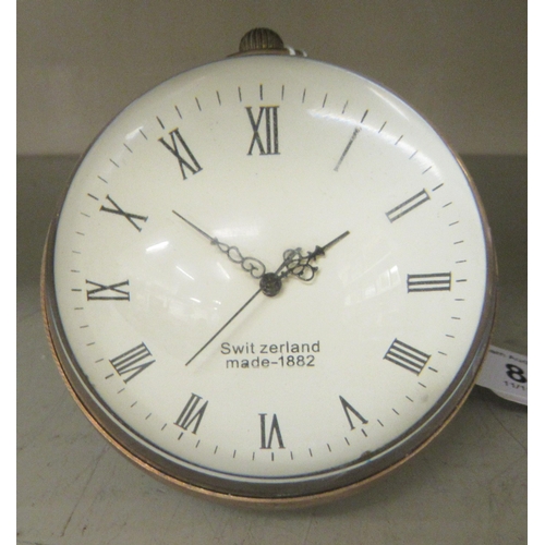 88 - A desk top clock, fashioned as a glass ball  3.5