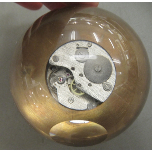 88 - A desk top clock, fashioned as a glass ball  3.5