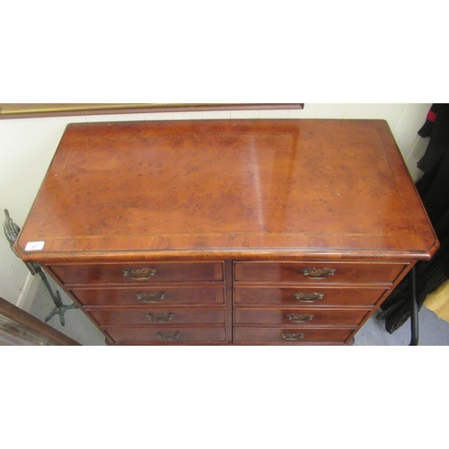 92 - A modern yew finished record cabinet with two doors and a hinged lid, raised on bracket feet  33