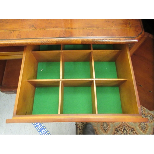 92 - A modern yew finished record cabinet with two doors and a hinged lid, raised on bracket feet  33