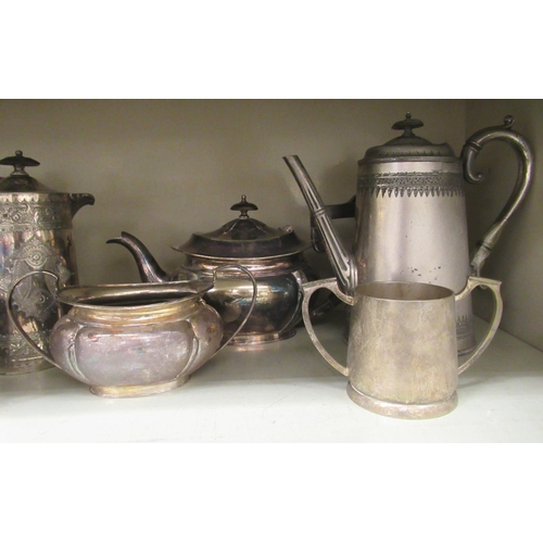 98 - Silver plate: to include a late Victorian hot water jug with an ear shaped handle 