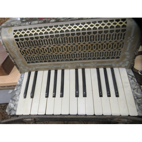 258 - A Laguna twelve key grey marble effect cased piano accordion 