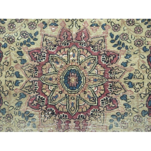 99 - A Kashan rug, decorated with flora and other ornament, on a red and blue ground 40