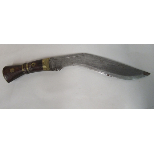 132 - An Indian kukri with a part brass bound handle, the blade 13.5