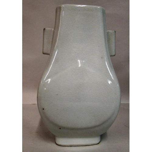 134 - An early 20thC Chinese blanc-de-chine Hu shaped vase with a peach design body and opposing handles  ... 