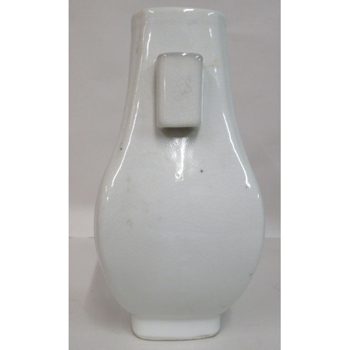 134 - An early 20thC Chinese blanc-de-chine Hu shaped vase with a peach design body and opposing handles  ... 