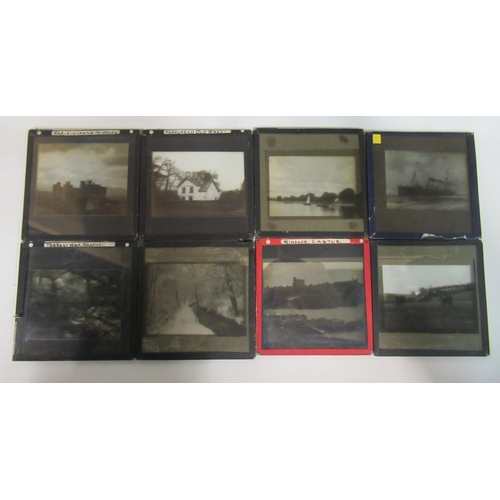135 - A quantity of late 19th/early 20thC coloured and monochrome photographic glass magic lantern slides:... 