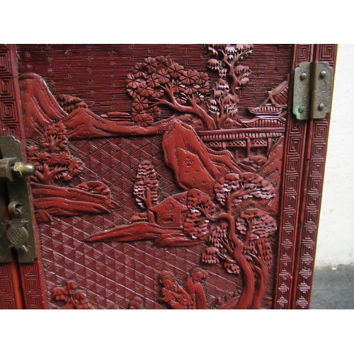 136 - A 19thC Chinese cinnabar table cabinet with a scholar's cap superstructure, on a Ming style base, fe... 