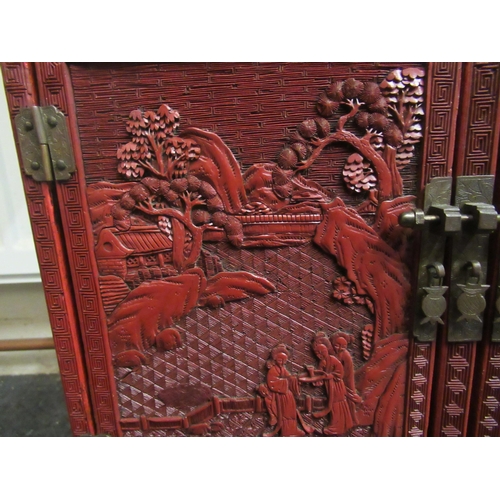 136 - A 19thC Chinese cinnabar table cabinet with a scholar's cap superstructure, on a Ming style base, fe... 