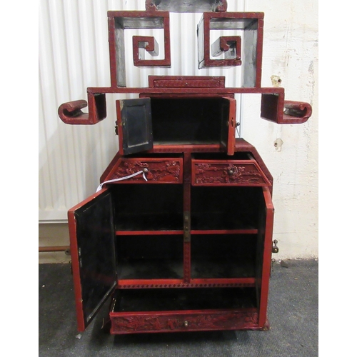 136 - A 19thC Chinese cinnabar table cabinet with a scholar's cap superstructure, on a Ming style base, fe... 