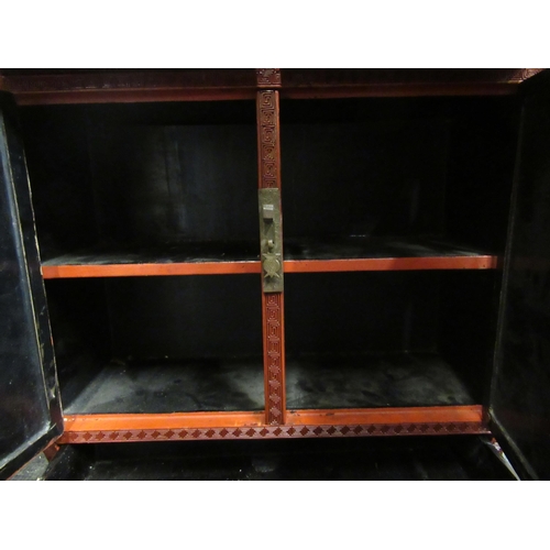 136 - A 19thC Chinese cinnabar table cabinet with a scholar's cap superstructure, on a Ming style base, fe... 