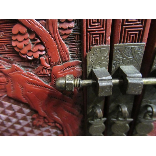 136 - A 19thC Chinese cinnabar table cabinet with a scholar's cap superstructure, on a Ming style base, fe... 