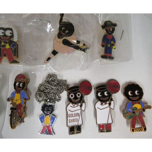 138 - Approx. twenty modern Robinson's Golly Golden Shred and other brooches