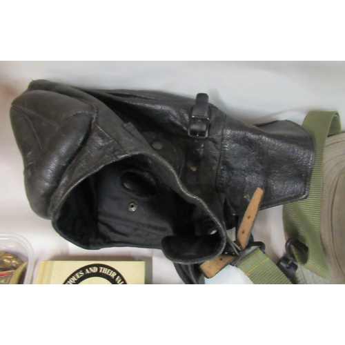 141 - Miscellaneous military and associated objects and printed ephemera: to include a buckled soft black ... 