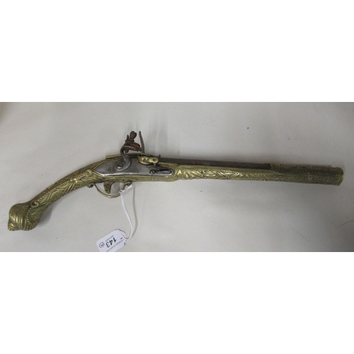 143 - A pair of decoratively cast brass and steel flintlock pistols&nbsp; approx 19