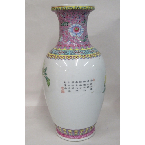 144 - A mid 20thC Chinese famille rose porcelain baluster shaped vase, having a waisted neck and flared up... 