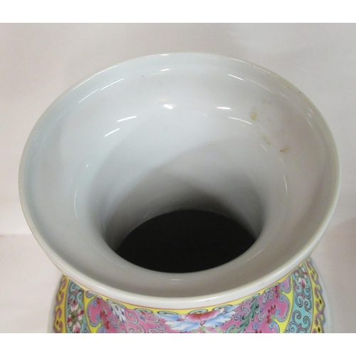 144 - A mid 20thC Chinese famille rose porcelain baluster shaped vase, having a waisted neck and flared up... 