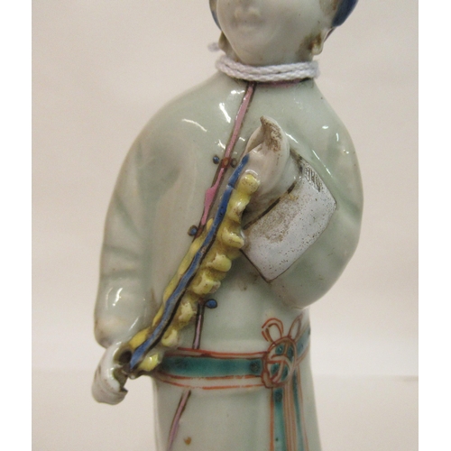 149 - A mid 18th Chinese famille rose porcelain standing figure, a market trader holding a money belt&nbsp... 