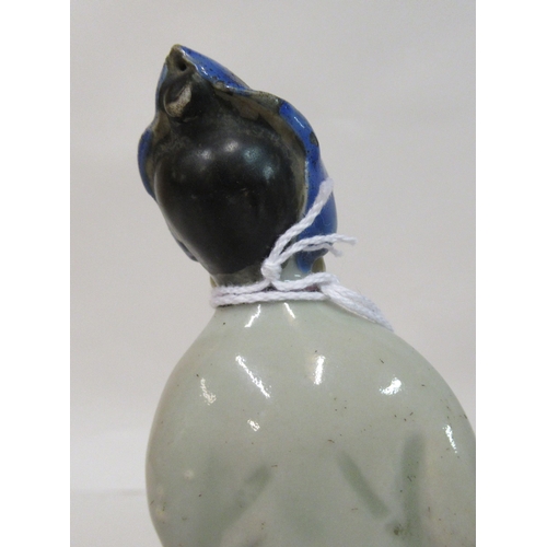 149 - A mid 18th Chinese famille rose porcelain standing figure, a market trader holding a money belt&nbsp... 