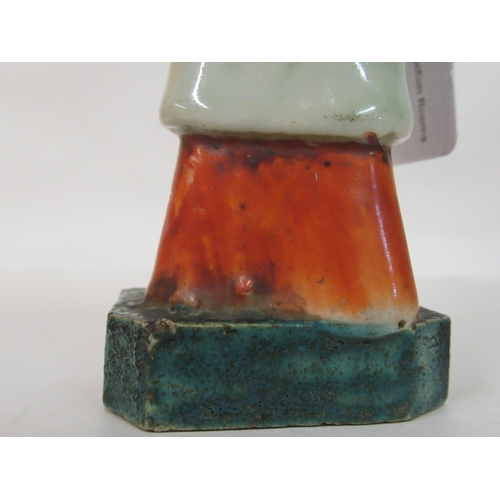 149 - A mid 18th Chinese famille rose porcelain standing figure, a market trader holding a money belt&nbsp... 