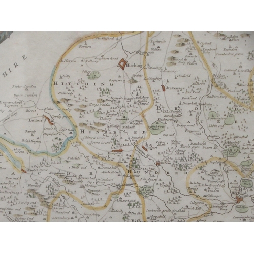 150 - An 18thC Robert Morden coloured county map 'Hertfordshire' incorporating a banner title cartouche an... 