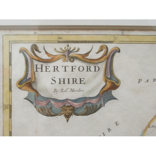 150 - An 18thC Robert Morden coloured county map 'Hertfordshire' incorporating a banner title cartouche an... 