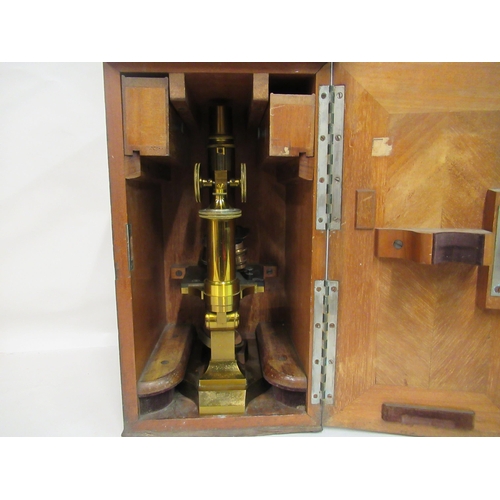 157 - A late 19thC E Leitz Wetzlar, no.20800, lacquered brass microscope with three rotating lenses and at... 