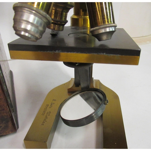 157 - A late 19thC E Leitz Wetzlar, no.20800, lacquered brass microscope with three rotating lenses and at... 