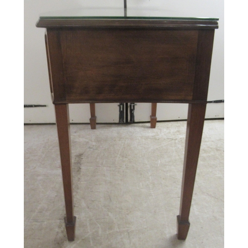 172 - An early 20thC mahogany bow front, two drawer sideboard, raised on square, tapered legs and spade fe... 