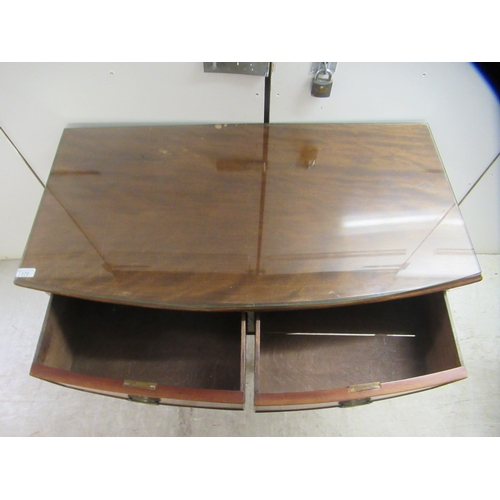 172 - An early 20thC mahogany bow front, two drawer sideboard, raised on square, tapered legs and spade fe... 