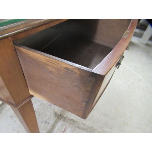 172 - An early 20thC mahogany bow front, two drawer sideboard, raised on square, tapered legs and spade fe... 