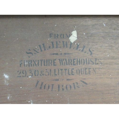 173 - An Edwardian mahogany dresser with an arrangement of open shelves and drawers, over two frieze drawe... 