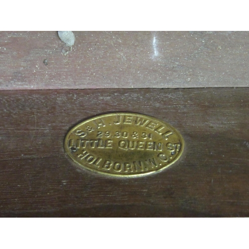 173 - An Edwardian mahogany dresser with an arrangement of open shelves and drawers, over two frieze drawe... 