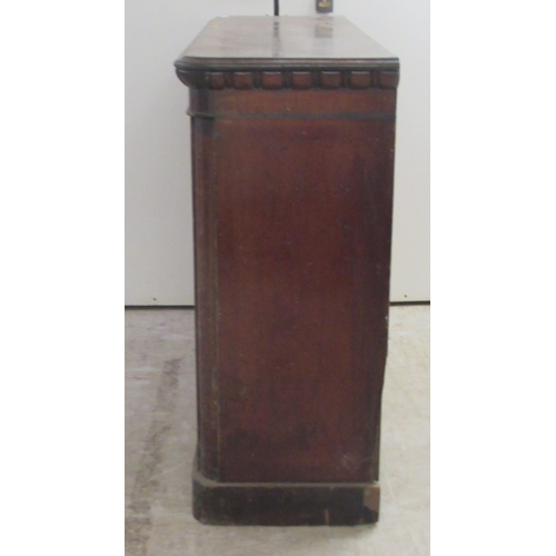 192 - A mid 19thC stained oak, open front, two tier bookcase, on a plinth   35