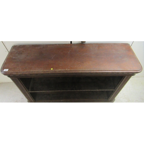 192 - A mid 19thC stained oak, open front, two tier bookcase, on a plinth   35