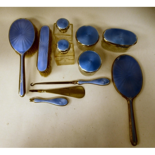 202 - Edwardian and later silver capped and backed dressing table items with blue enamelled and ribbon tie... 