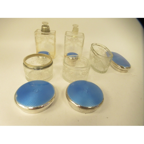 202 - Edwardian and later silver capped and backed dressing table items with blue enamelled and ribbon tie... 