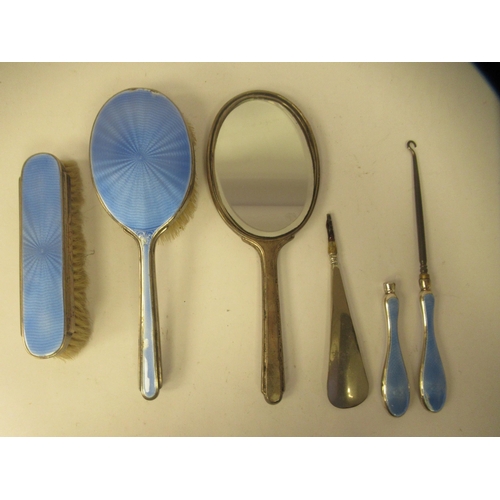 202 - Edwardian and later silver capped and backed dressing table items with blue enamelled and ribbon tie... 