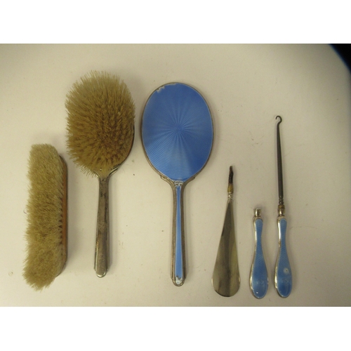 202 - Edwardian and later silver capped and backed dressing table items with blue enamelled and ribbon tie... 