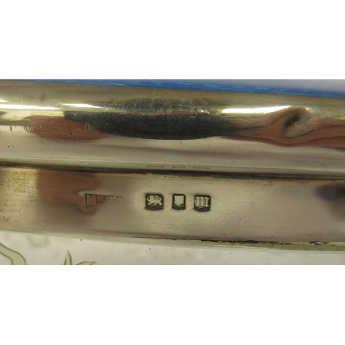 202 - Edwardian and later silver capped and backed dressing table items with blue enamelled and ribbon tie... 