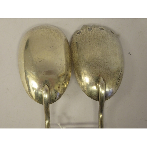 204 - A pair of late Victorian silver salad servers with cut glass handles  Chester 1886