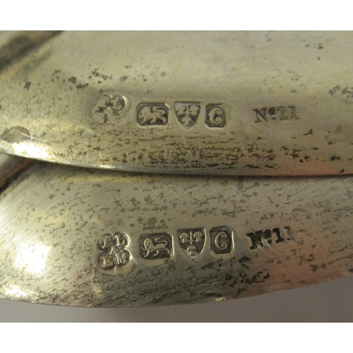 204 - A pair of late Victorian silver salad servers with cut glass handles  Chester 1886