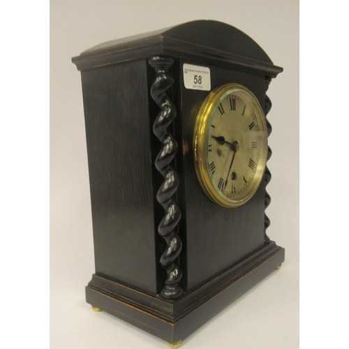 58 - A late 19th/early 20thC stained oak cased, round arched mantel timepiece; the 8 day Astral movement ... 
